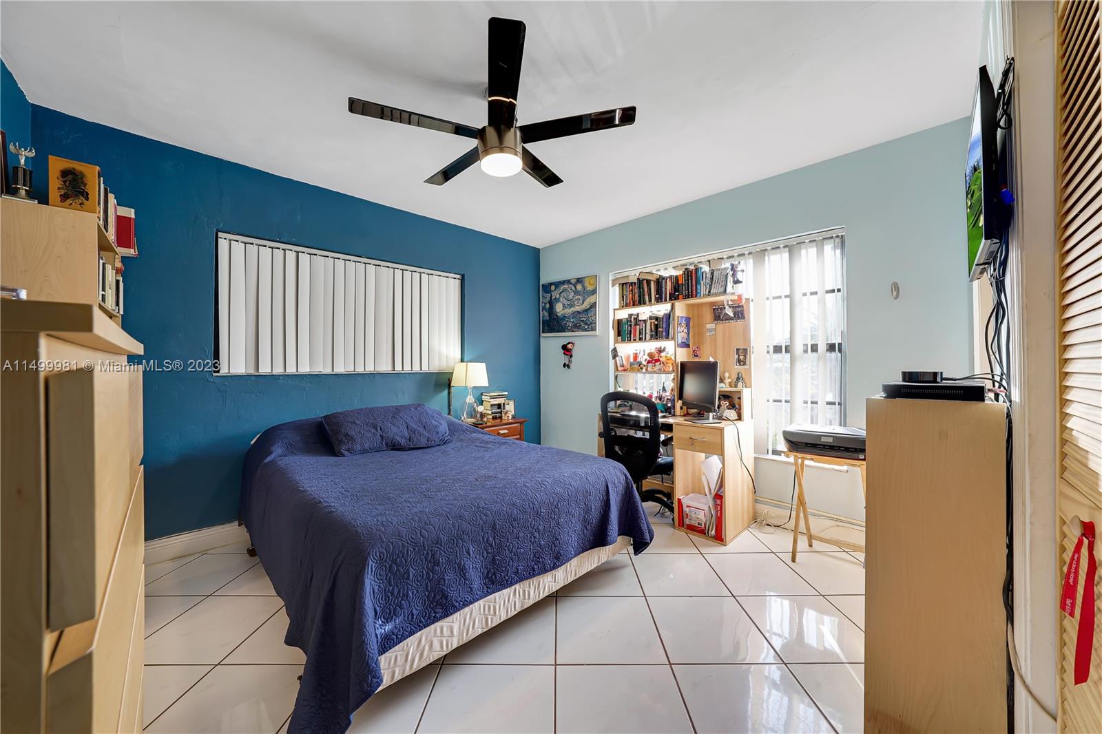 2755 Southwest 33rd Court Miami, FL 33133 - Photo 12 of 22 a bedroom with a bed dresser and a window