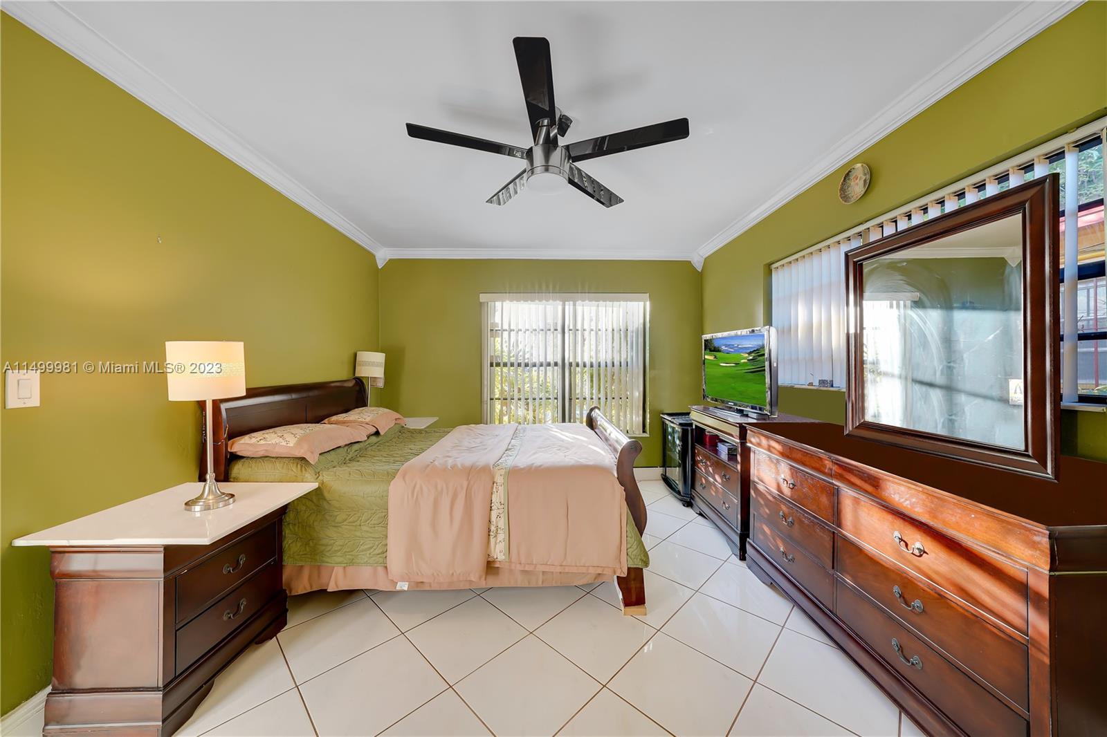 2755 Southwest 33rd Court Miami, FL 33133 - Photo 14 of 22 a bedroom with a bed and a large window