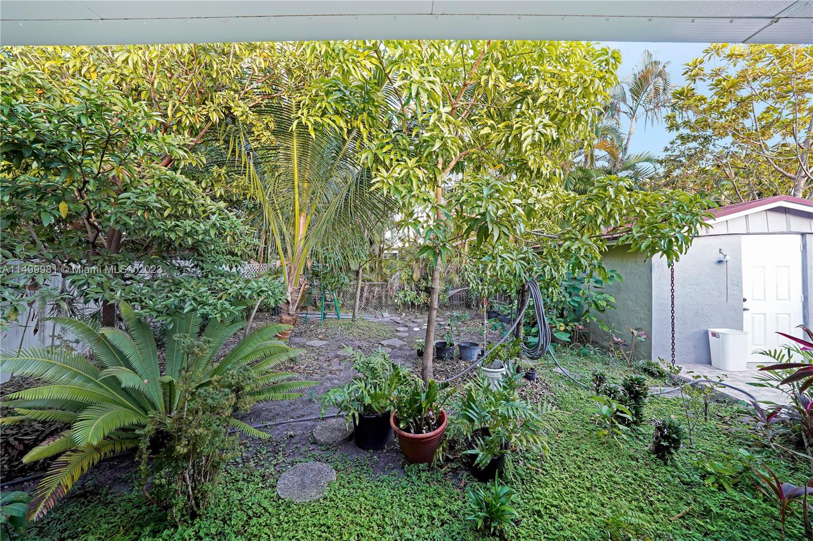 2755 Southwest 33rd Court Miami, FL 33133 - Photo 18 of 22 a view of a garden with plants and large trees