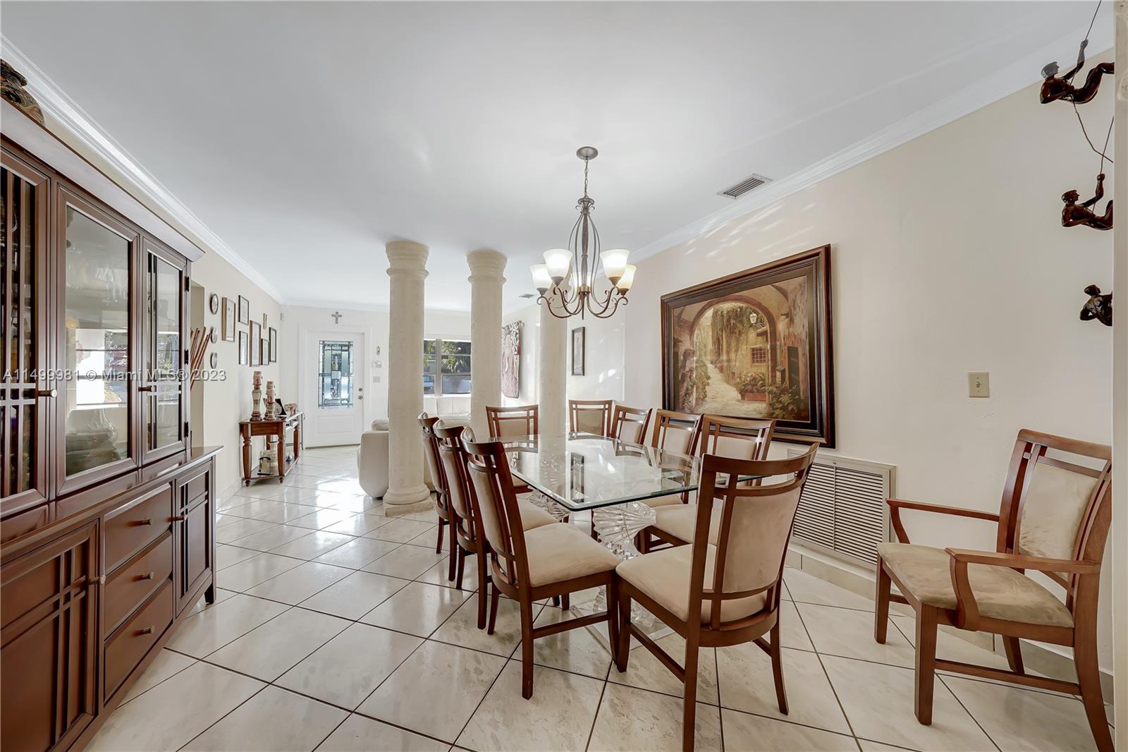 2755 Southwest 33rd Court Miami, FL 33133 - Photo 6 of 22 a view of a dining room with furniture and chandelier