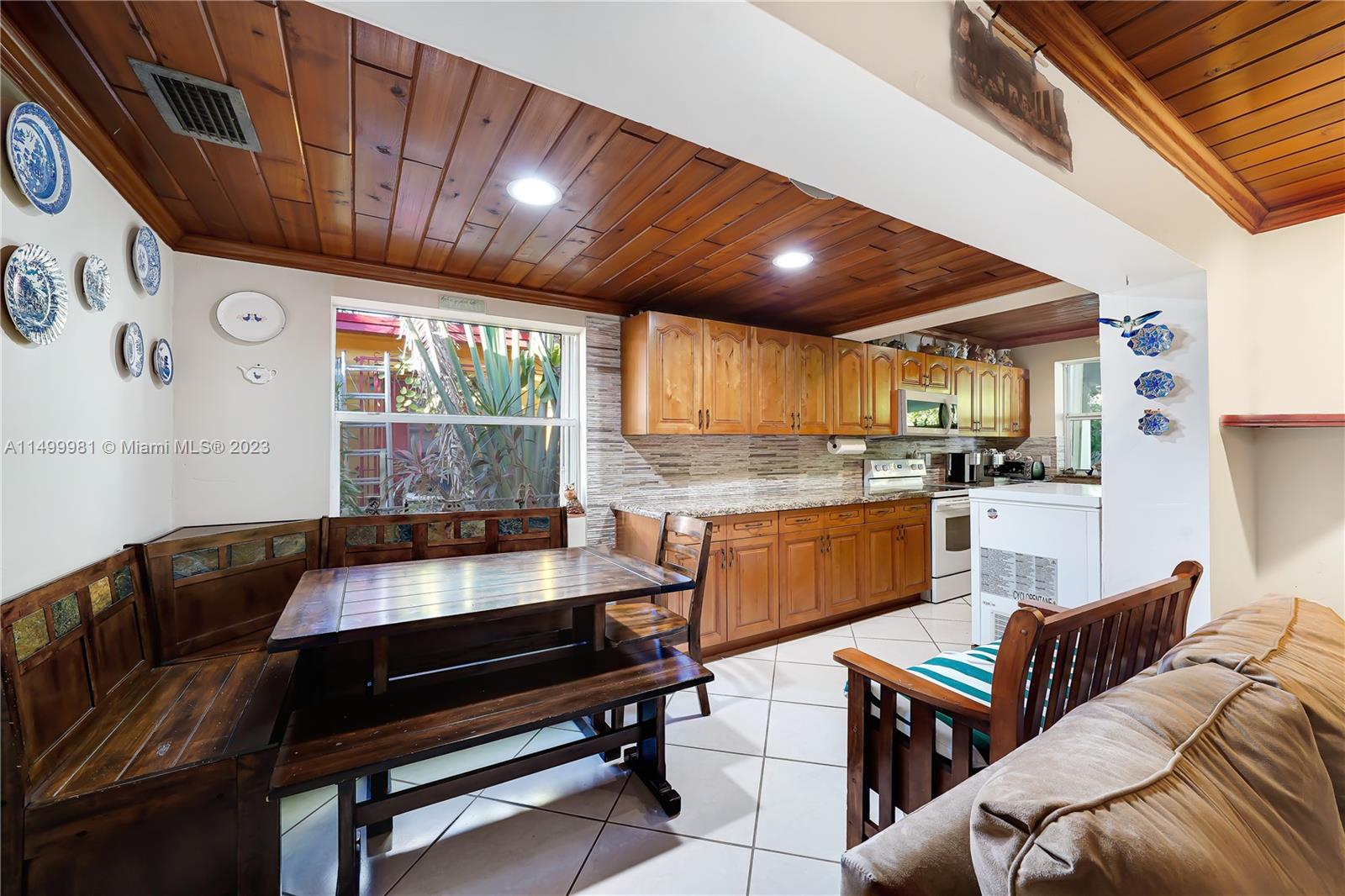 2755 Southwest 33rd Court Miami, FL 33133 - Photo 7 of 22 a living room with furniture and kitchen view