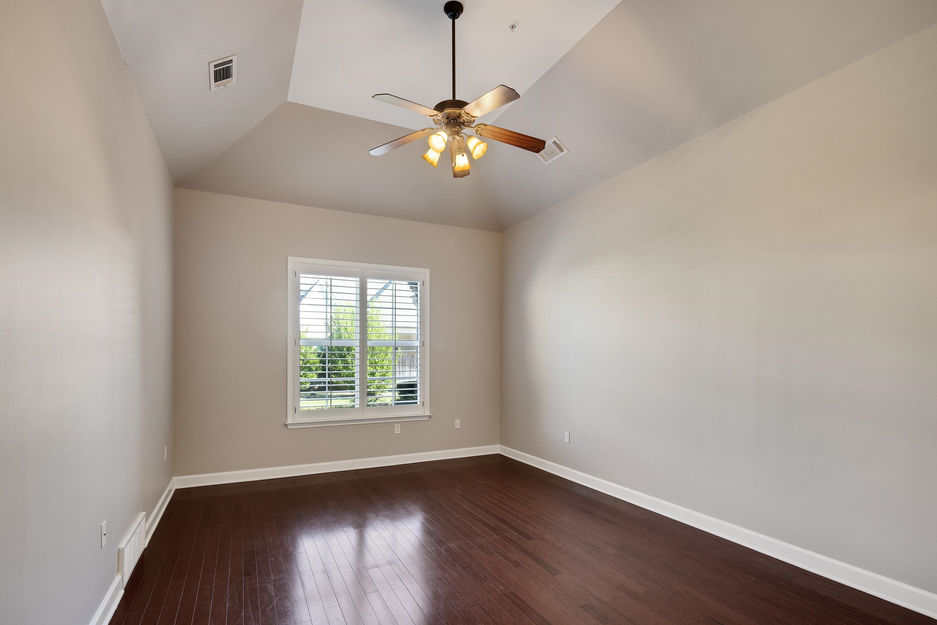 1422 Calumet Farms Drive, Unit 7 Collierville, TN 38017 - Photo 19 of 29 wooden floor in an empty room with a window