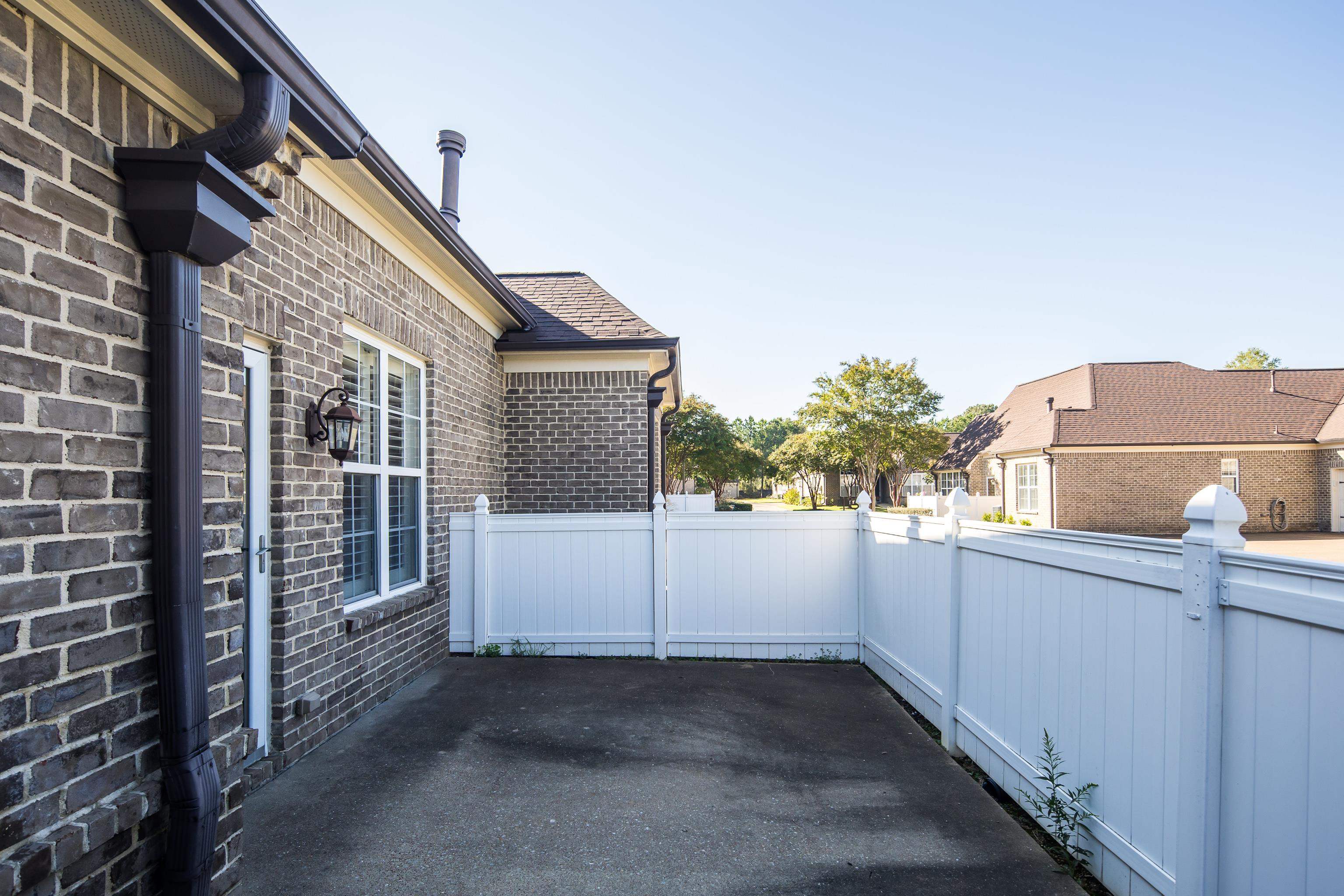 1422 Calumet Farms Drive, Unit 7 Collierville, TN 38017 - Photo 28 of 29 a view of a house with a street