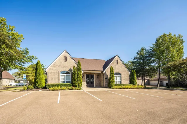 a view of a house with a yard and garage