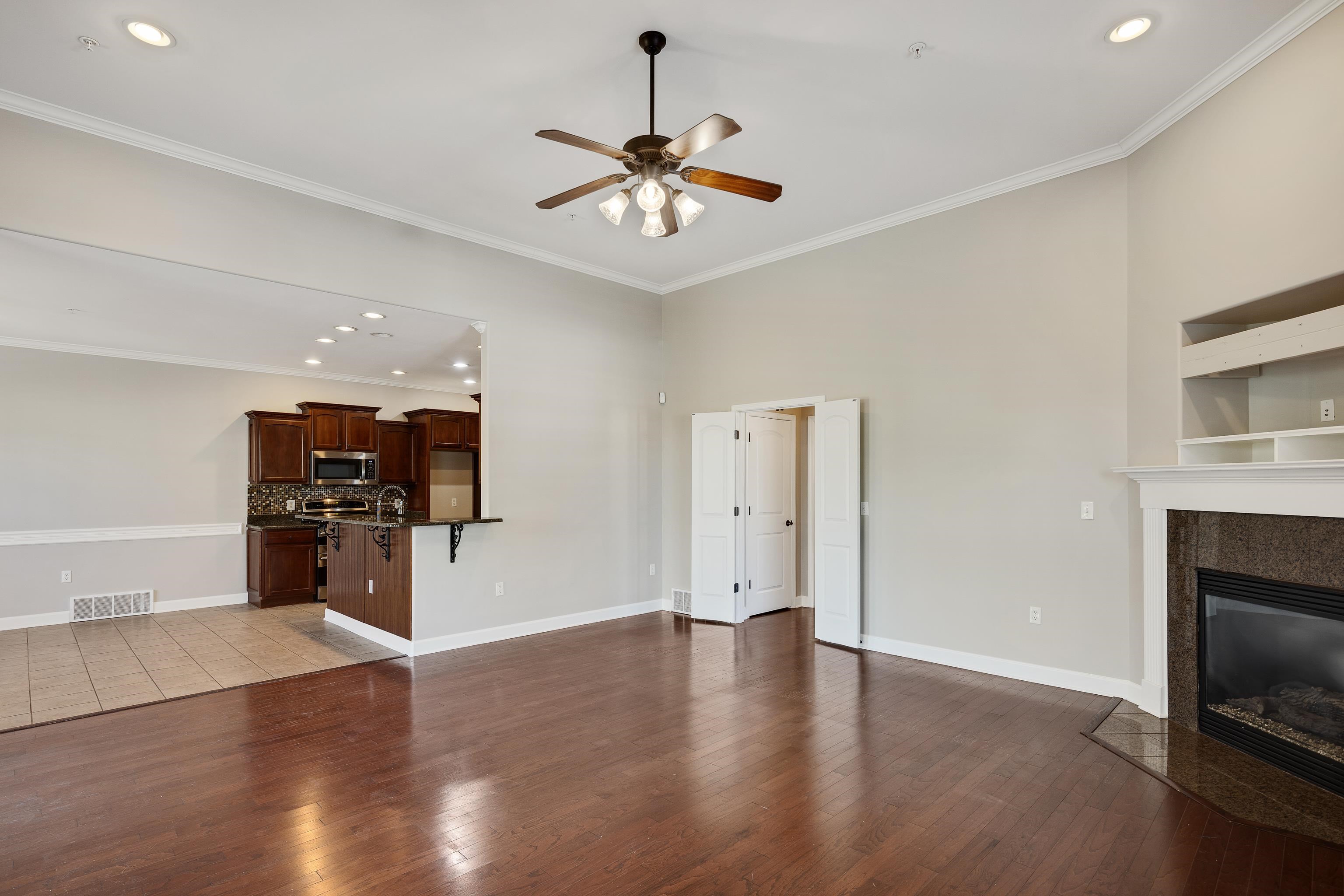 1422 Calumet Farms Drive, Unit 7 Collierville, TN 38017 - Photo 8 of 29 a view of a livingroom with a flat screen tv