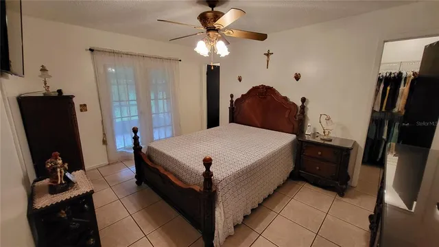 a bed room with a bed and a dresser