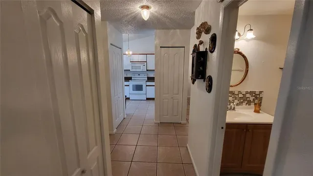 a bathroom with a sink and mirror