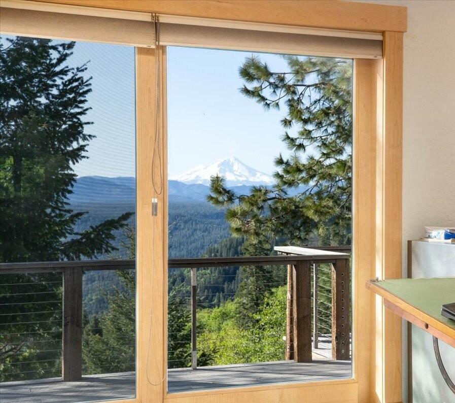 19649 Cove Road Montgomery Creek, CA 96065 - Photo 21 of 65 a view of a glass door with a tree in front of it