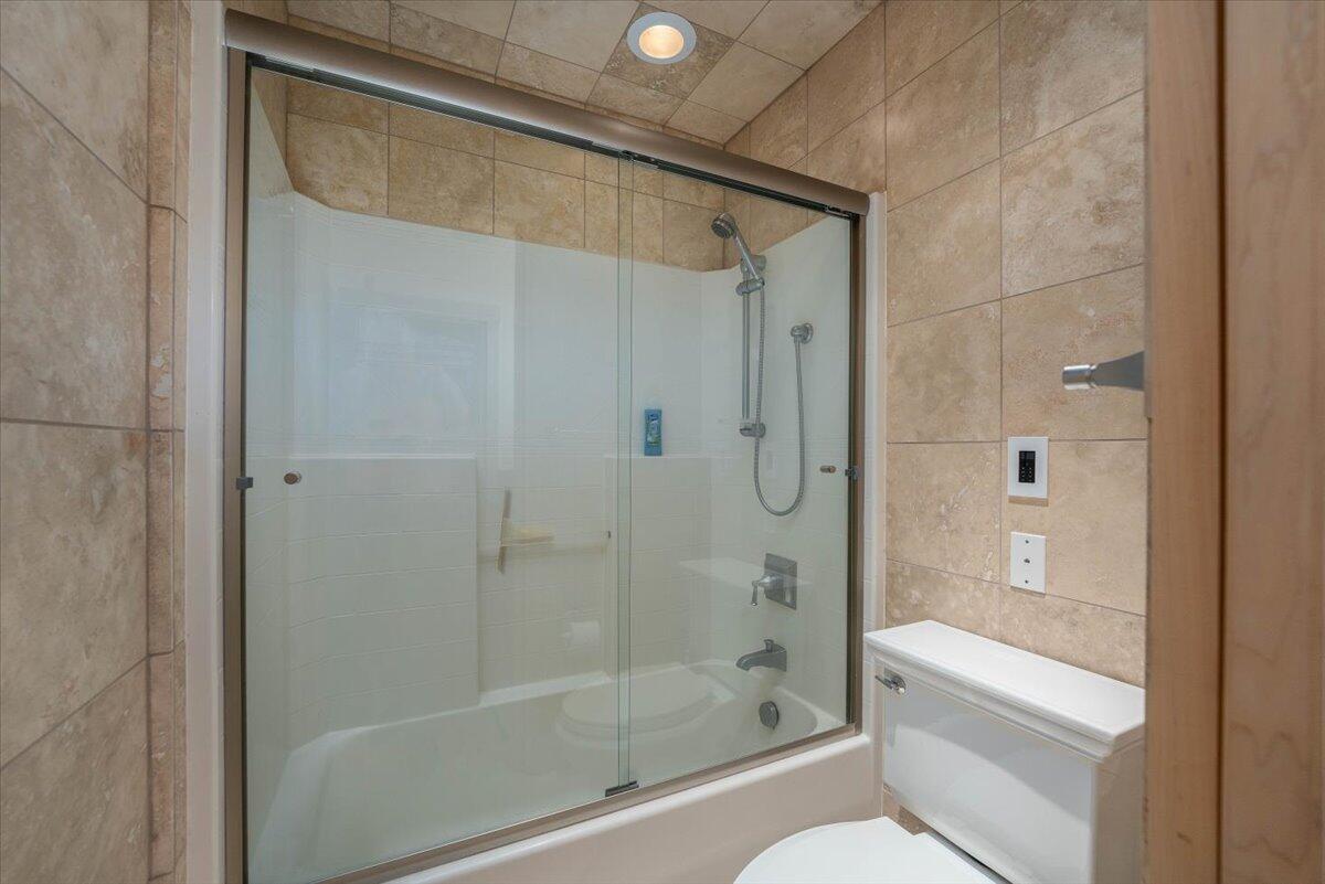 19649 Cove Road Montgomery Creek, CA 96065 - Photo 36 of 65 a bathroom with a shower and a toilet