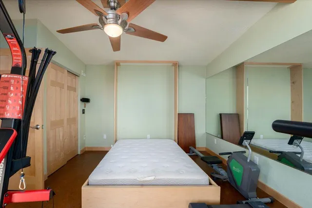 a view of balcony with floor to ceiling window and wooden floor