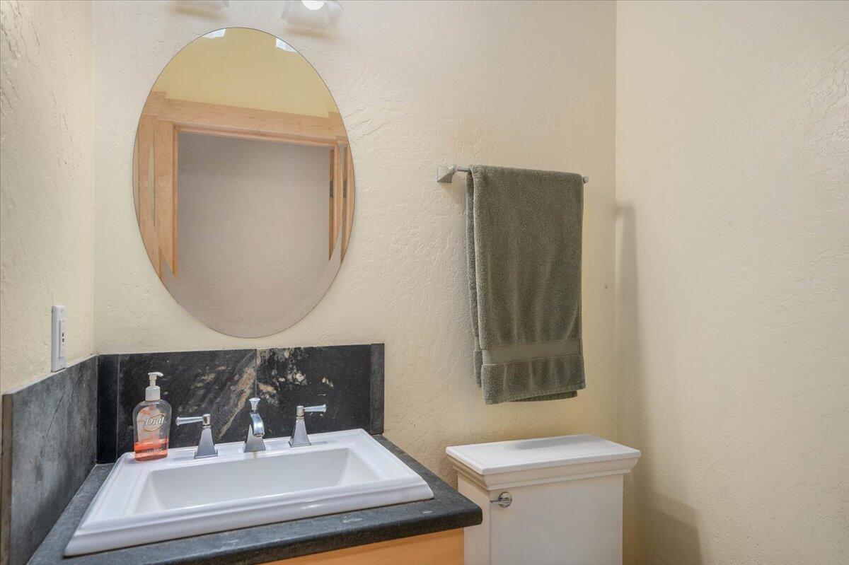 19649 Cove Road Montgomery Creek, CA 96065 - Photo 40 of 65 a bathroom with a sink and a mirror