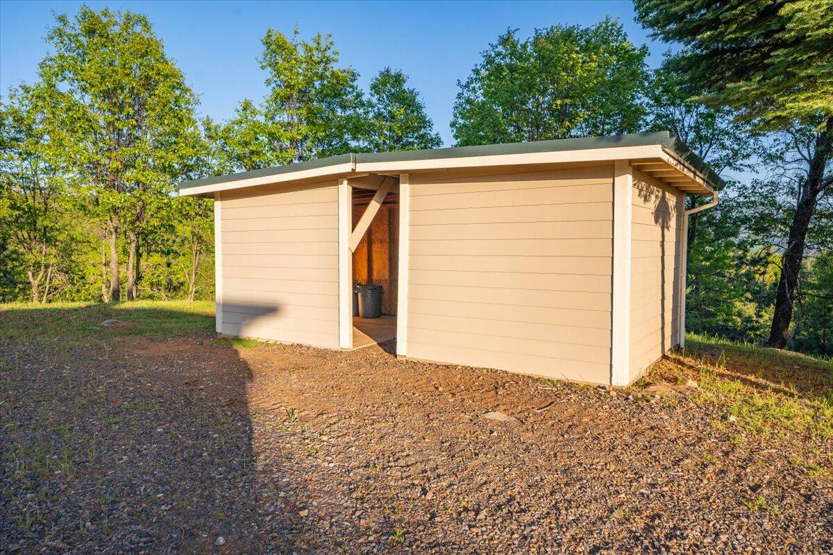 19649 Cove Road Montgomery Creek, CA 96065 - Photo 43 of 65 a view of a house with a backyard