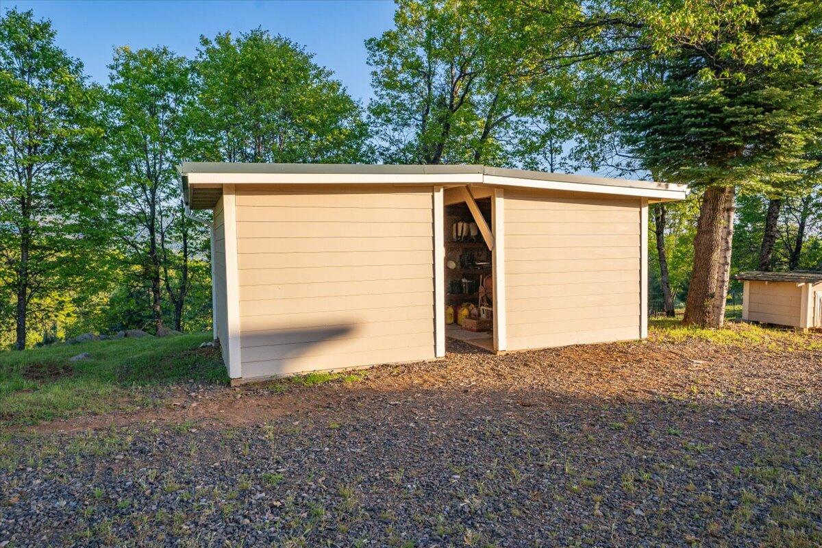19649 Cove Road Montgomery Creek, CA 96065 - Photo 44 of 65 a view of a house with a backyard