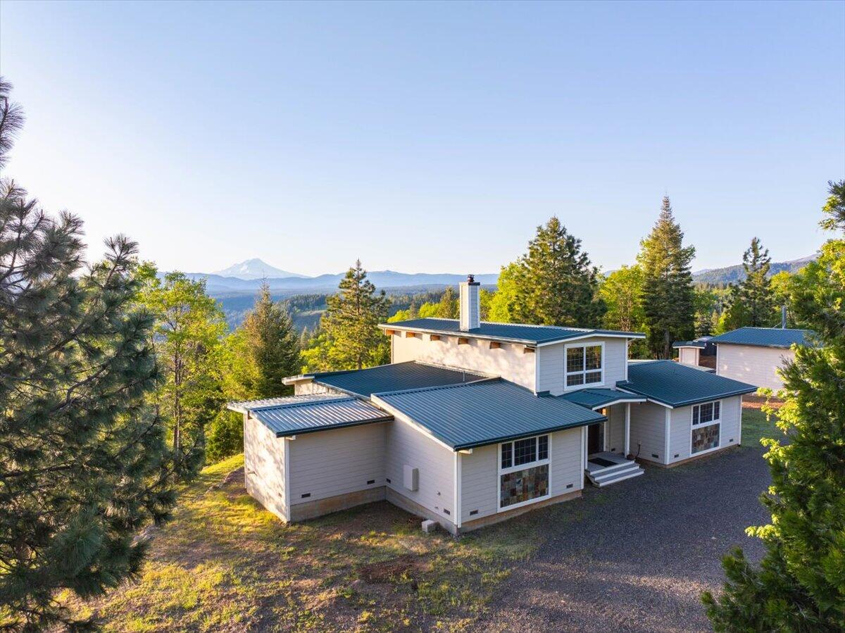 19649 Cove Road Montgomery Creek, CA 96065 - Photo 64 of 65 a aerial view of a house with a yard and mountain view in back