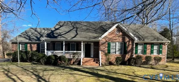 a view of house with a patio