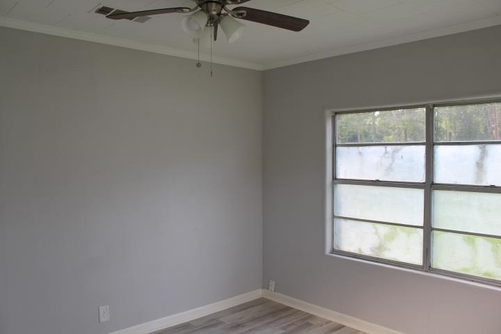875 Woodrow Street Silsbee, TX 77656 - Photo 23 of 30 an empty room with a window