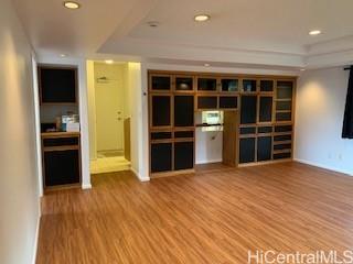 45-906 Anoi Road, Unit A Kaneohe, HI 96744 - Photo 10 of 19 a view of empty room with wooden floor and windows