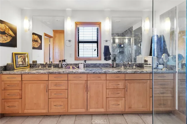 a bathroom with cabinets and a sink