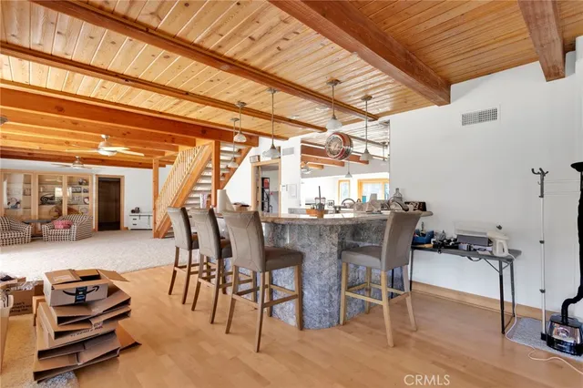 a view of a livingroom with furniture and a window
