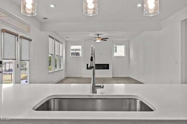 a kitchen with cabinets and a refrigerator