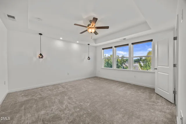 a view of kitchen and hall with wooden floor