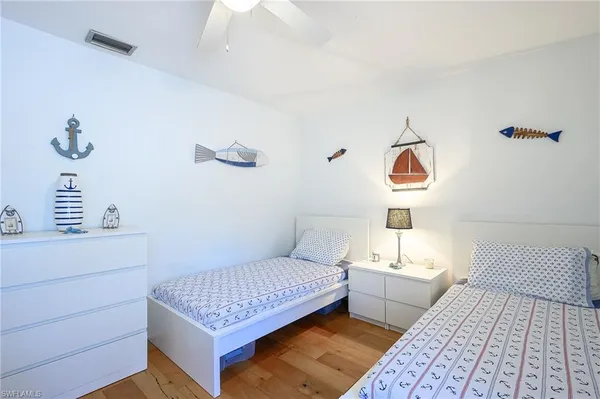 a bedroom with a bed and cabinets
