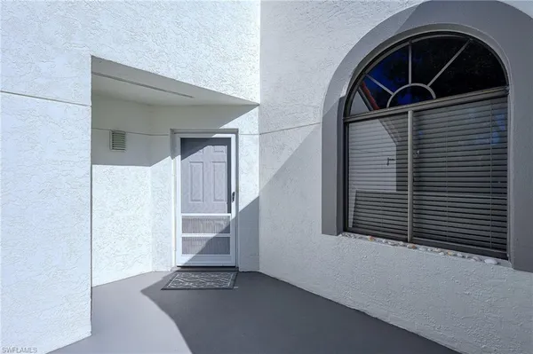 a view of empty room with stairs