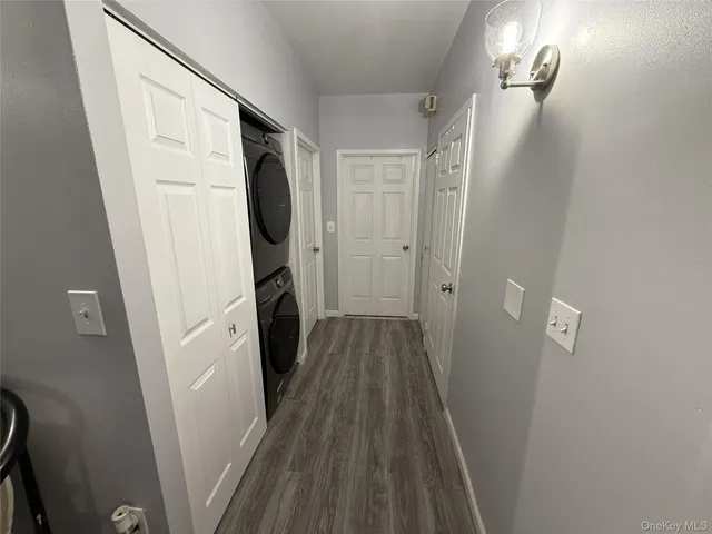 a view of a room with wooden floor and staircase