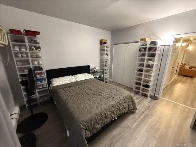 a bedroom with a bed and a walk in closet