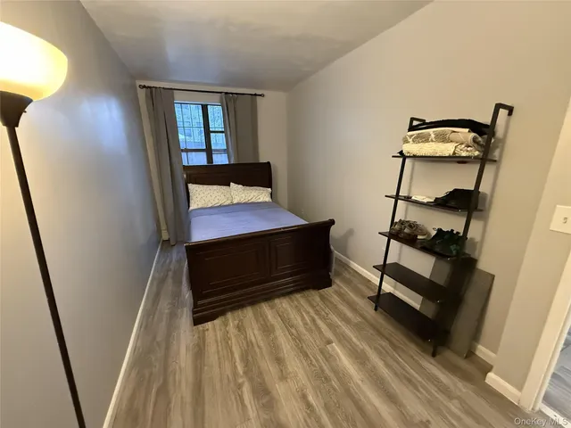 a room with wooden floor and stairs