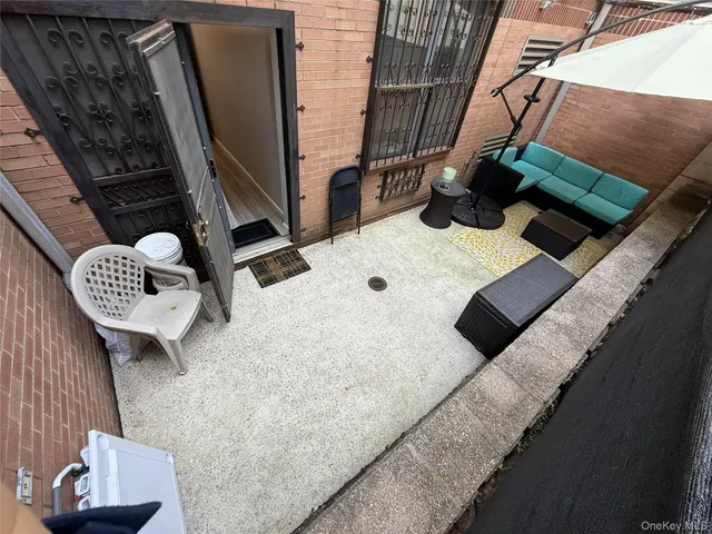a view of living room with furniture and a window