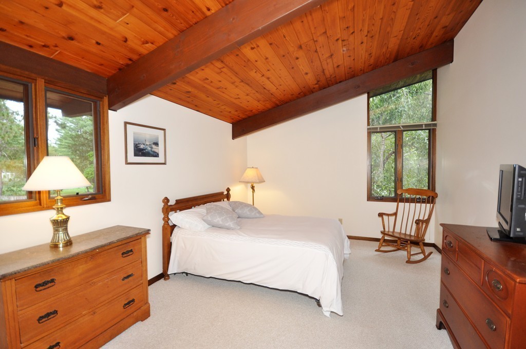 90 Indian Spring Road Concord, MA 01742 - Photo 8 of 13 a spacious bedroom with a bed and a desk