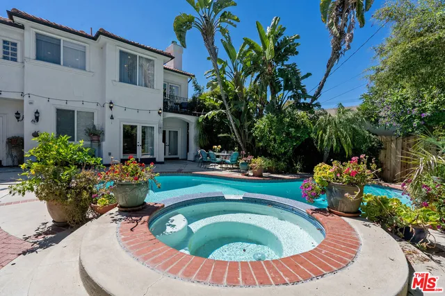 a view of a swimming pool with a patio
