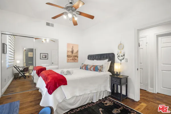 a living room with fireplace furniture and a large window