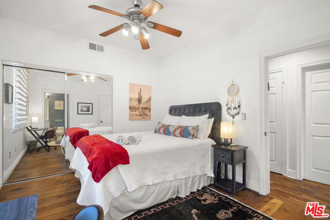 4544 Tobias Avenue Sherman Oaks, CA 91403 - Photo 20 of 55 a bedroom with a bed and wooden floor