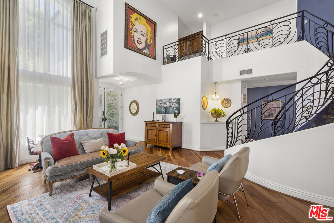 4544 Tobias Avenue Sherman Oaks, CA 91403 - Photo 23 of 55 a living room with furniture and paintings on the wall