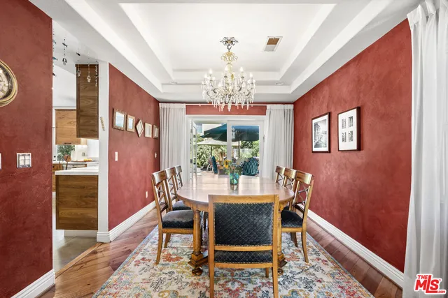 a kitchen with granite countertop a counter space a sink stainless steel appliances and cabinets