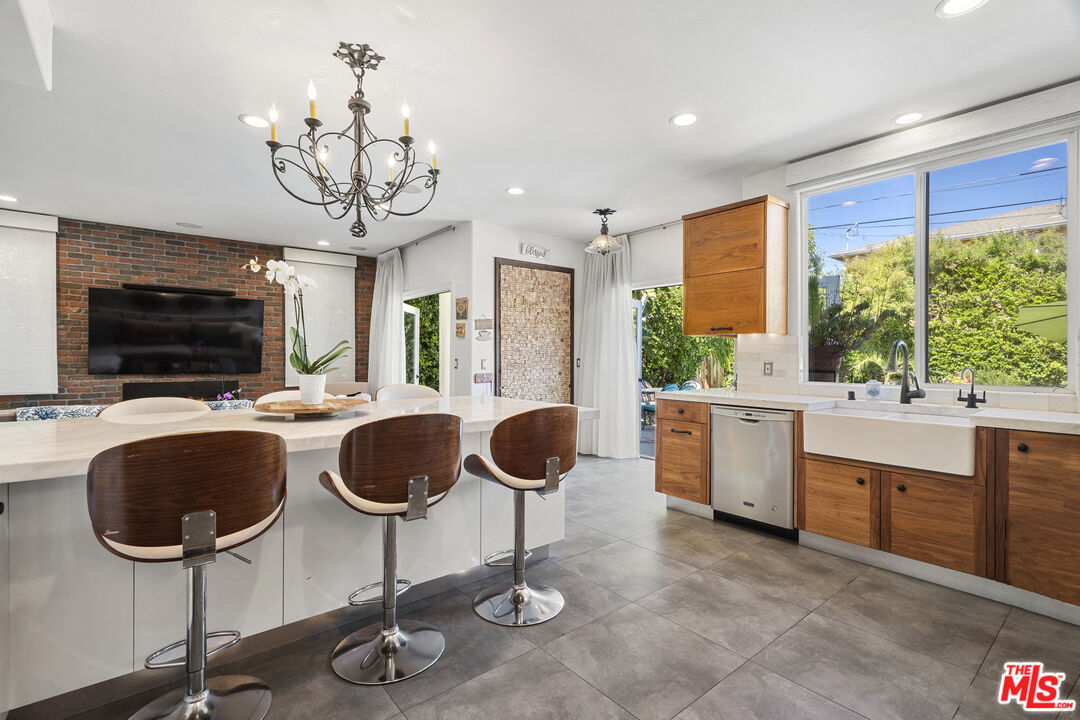 4544 Tobias Avenue Sherman Oaks, CA 91403 - Photo 26 of 55 a kitchen with granite countertop a counter space a sink stainless steel appliances and cabinets