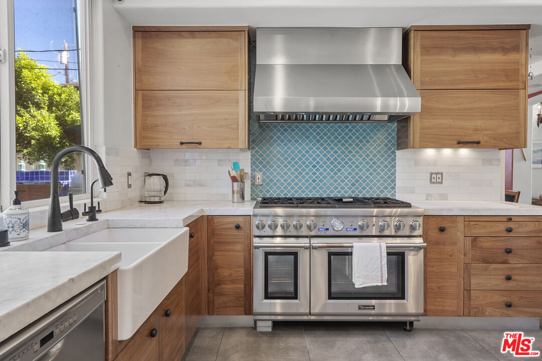 4544 Tobias Avenue Sherman Oaks, CA 91403 - Photo 29 of 55 a kitchen with a stove and a sink