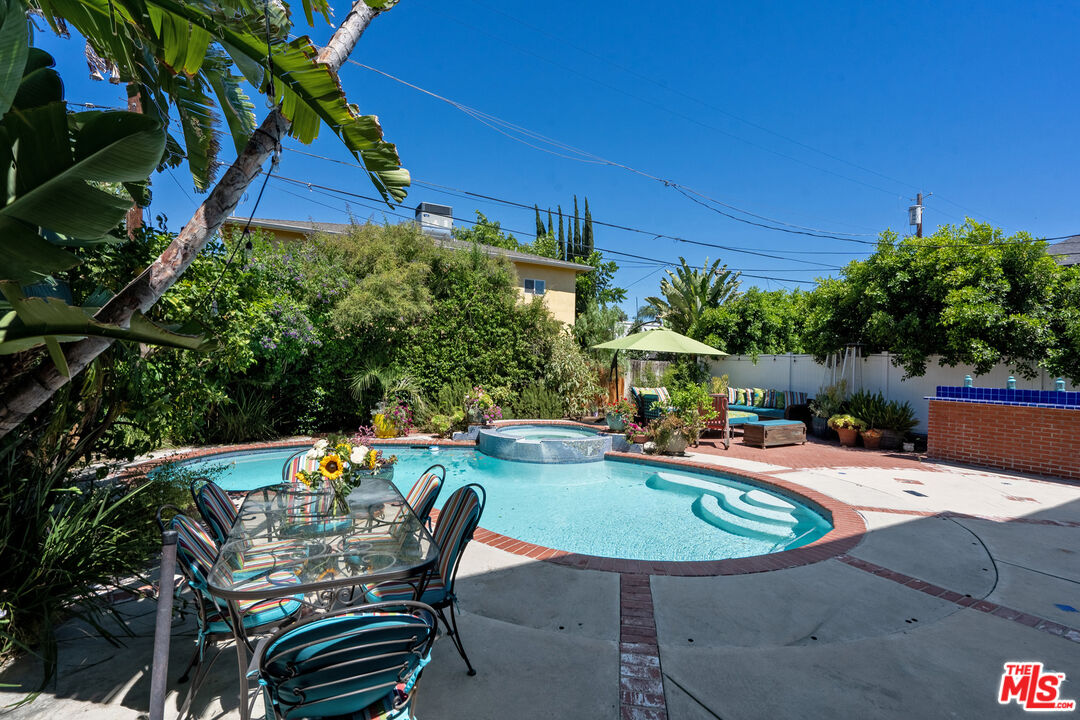4544 Tobias Avenue Sherman Oaks, CA 91403 - Photo 3 of 55 a swimming pool with outdoor seating