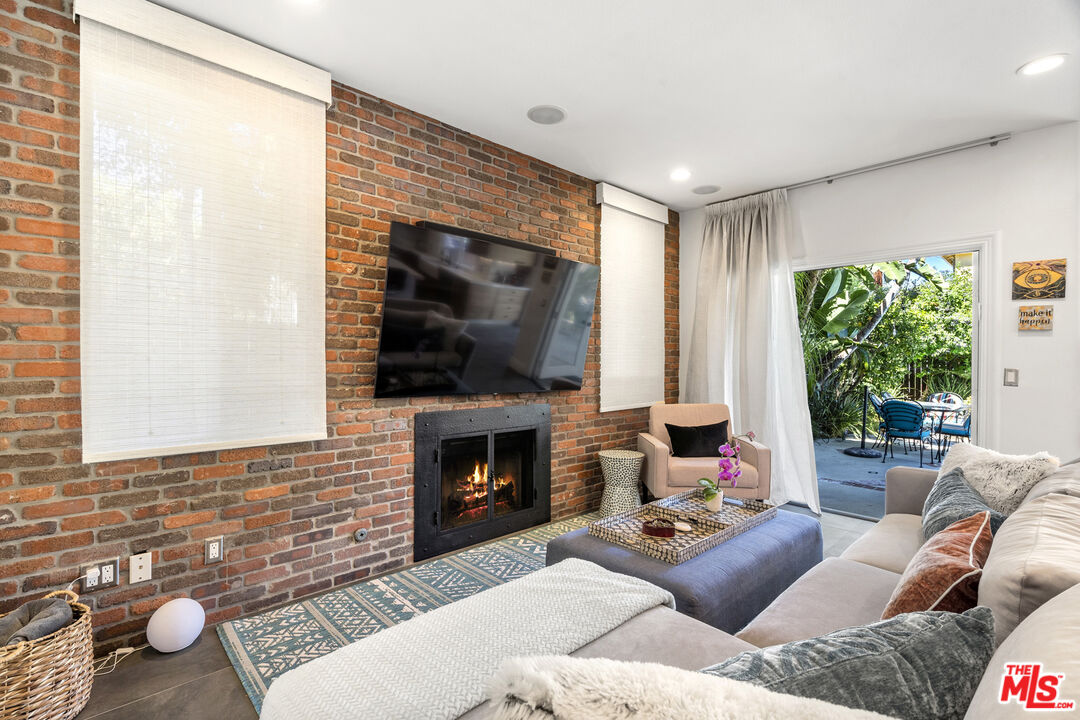 4544 Tobias Avenue Sherman Oaks, CA 91403 - Photo 33 of 55 a living room with furniture and a fireplace