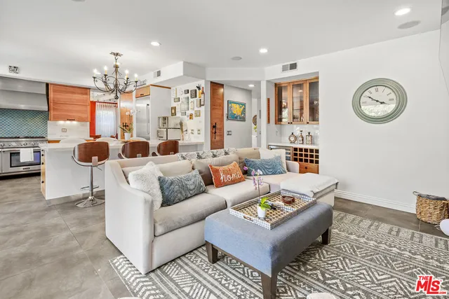 a bed room with a bed and a chair