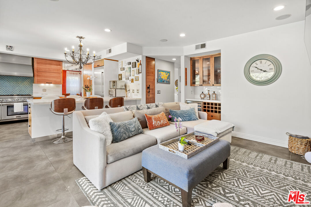 4544 Tobias Avenue Sherman Oaks, CA 91403 - Photo 35 of 55 a living room with furniture and a chandelier