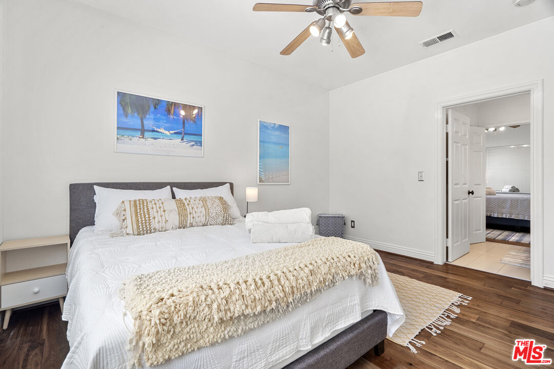 4544 Tobias Avenue Sherman Oaks, CA 91403 - Photo 51 of 55 a bedroom with a bed and a chandelier