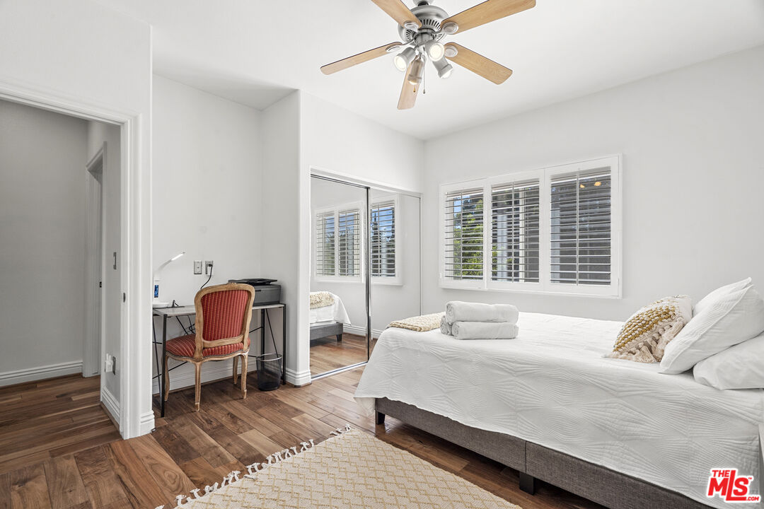 4544 Tobias Avenue Sherman Oaks, CA 91403 - Photo 52 of 55 a bedroom with a bed chair and wooden floor