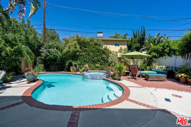 a view of a swimming pool with a patio