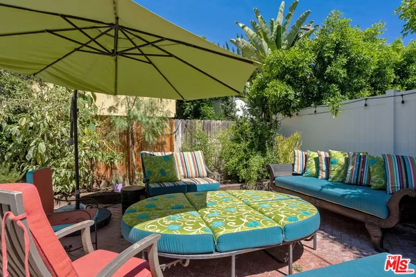 a view of a chairs and table in the patio