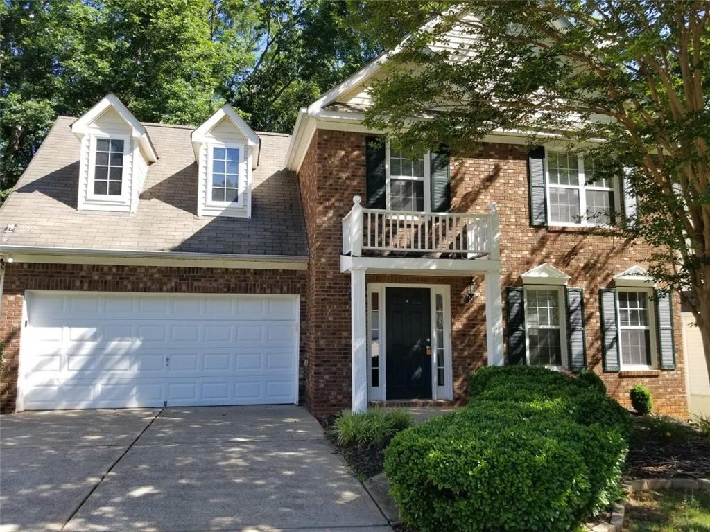2040 Ridgestone Landing Southwest Marietta, GA 30008 - Photo 1 of 1 a front view of a house with a porch