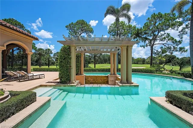 a view of a house with backyard and porch