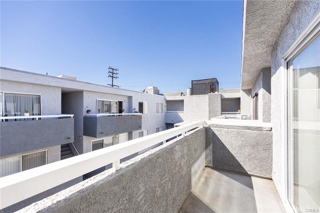 4406 Cahuenga Boulevard, Unit 202 Toluca Lake, CA 91602 - Photo 11 of 16 a living room with furniture and a flat screen tv